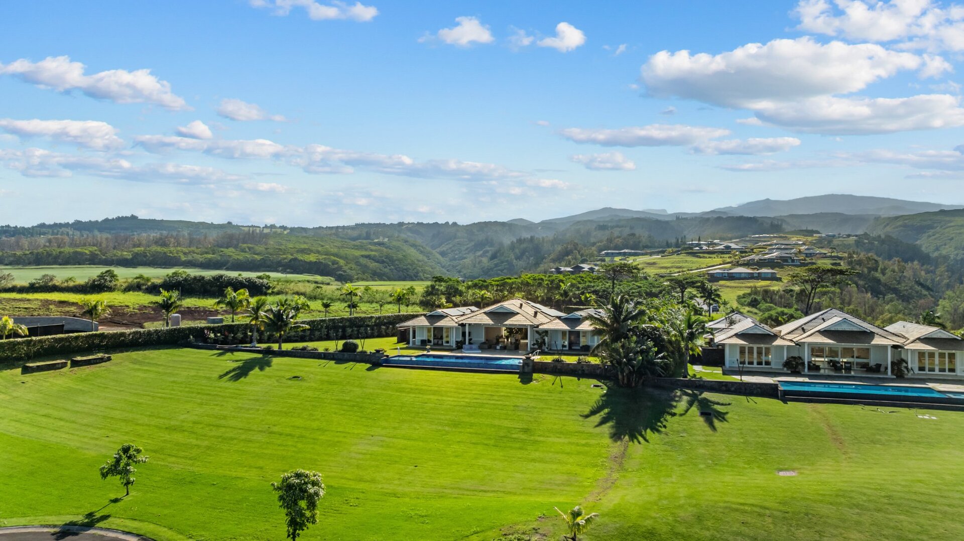  Aerial side view 300 Mahana Ridge showing expansive grounds and West Maui valley setting Mahana Estates