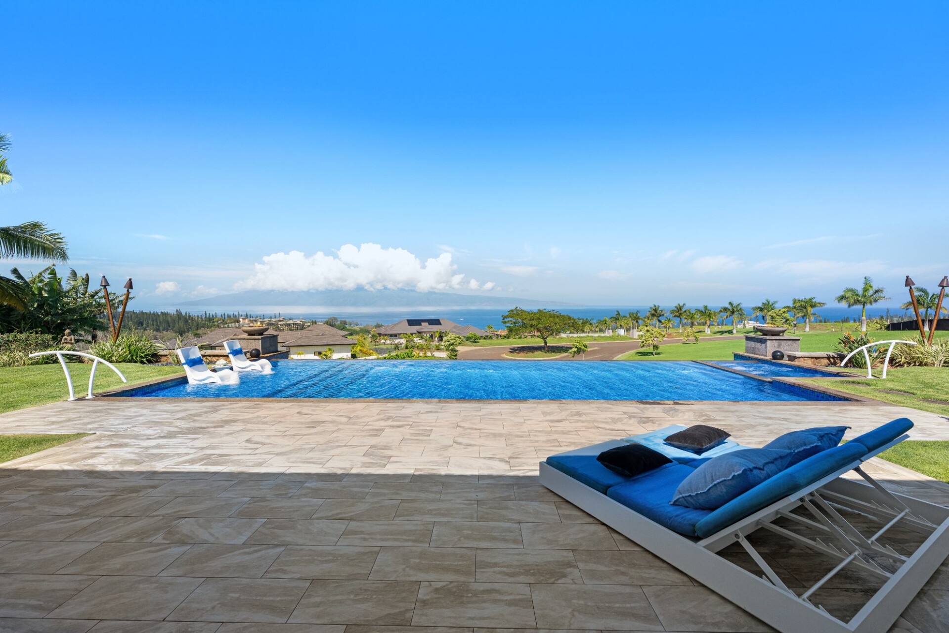 Infinity pool with Pacific Ocean and Molokai island views from 300 Mahana Ridge luxury estate Kapalua Maui